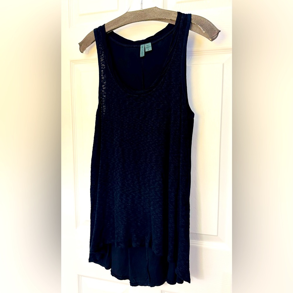 Left of Center sleeveless, scoop neck, midnight blue top, high-lo hem.